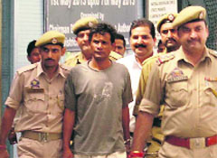 Vinod Kumar outside a court in Jammu.