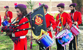 Sanaullah (playing bagpipes) and other prisoners perform in Kot Bhalwal jail on World Music Day.