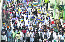 SGPC and SAD workers lead a protest march against Sajjan Kumars acquittal in an anti-Sikh riots case, in Jalandhar on Thursday. 