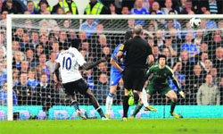 Tottenham Hotspurs Emmanuel Adebayor scores during their English Premier League match against Chelsea in London. The match ended in a 2-2 draw.  Reuters
