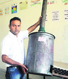 Sanjeev Sayal displays the equipment designed by his students in Amritsar. 
