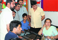 Victim Ankit (blue shirt) and his relatives meet principal of Government Model Middle School at Indra Colony, Chandigarh, on Friday.