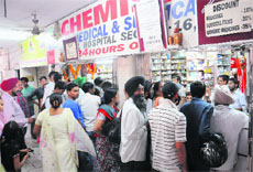 A heavy rush at a chemist shop in Chandigarh on Friday.