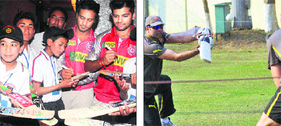 and (right) VVS Laxman in action during a practice session at the PCA stadium at Mohali on Friday. 