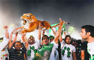 Nawaz Sharifs supporters with the party symbol