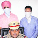 The two clerks in police custody in Jalandhar on Friday. 