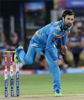 Pune Warriors Parvez Rasool in action against Kolkata Knight Riders in Pune on Thursday. 