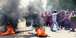 Protesters block national highway against alleged illegal detention of a girl at Mishriwala in Jammu on Friday. A tribune photo