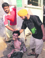 Residents of the Pratap Colony with the thief. a tribune photograph