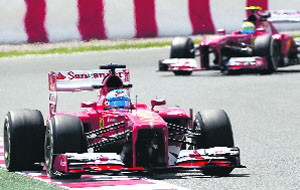 Ferraris Fernando Alonso drives ahead of teammate Felipe Massa during the second practice session of the Spanish F1 Grand Prix in Barcelona. 