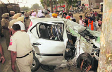 The mangled remains of the car that rammed into a tree in Amritsar on Saturday.