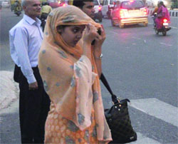 Commuters caught in a dust storm at ITO in New Delhi on Saturday. 