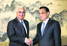 External Affairs Minister Salman Khurshid meets Chinese Premier Li Keqiang in Beijing on Friday.