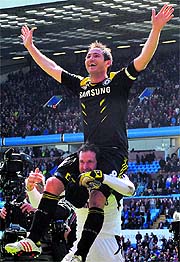 Chelseas Frank Lampard is carried aloft by goalkeeper Petr Cech after they beat Aston Villa. Lampard became Chelseas highest goal-scorer, beating Bobby Tamblings Chelsea record of 202 goals