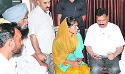 The police assault victim talks to SC/ST Commission Vice-Chairman Raj Kumar Verka in Amritsar on Sunday