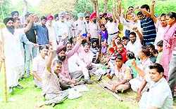 Members of the Handicapped Welfare Association hold a protest at Company Bagh in Amritsar on Sunday