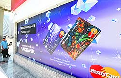 A sign displaying ATM prepaid cards at a RAKBANK branch at Dubai Marina in Dubai. Two companies with major operations in India were the weak links that opened the door to a $45 million global cyber heist brought to light by US authorities this week