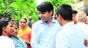Former Union Railway Minister Pawan Kumar Bansals younger son Manish Bansal interacts with supporters at his residence in Sector 28, Chandigarh, on Sunday. 