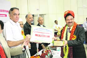 Director General, ICFRE, Dr VK Bahuguna confers Uttarakhand Ratna upon Jitendra Joshi in Dehradun on Sunday