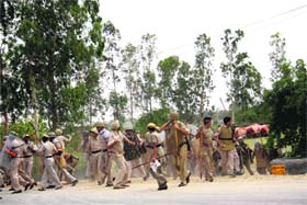 A heavy police force deployed to maintain law and order at Karontha village in Rohtak district on Sunday