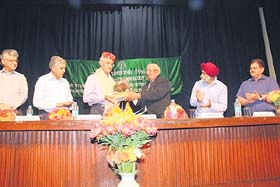 Brij Behari Lal Butail, Speaker of the Himachal Assembly, addresses a gathering at the IHBT in Palampur
