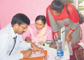 Dr PC Negi of the IGMC, Shimla, examines a patient during a heart camp at Sundernagar on Sunday