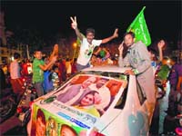 Supporters of Pakistan Muslim League-N celebrate the victory of their party in elections in Lahore