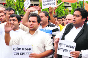 Members of the Bharatiya Janata Yuva Morcha stage a protest against the UPA government in Jammu on Sunday. 
