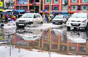 A waterlogged road in Srinagar on Sunday. 