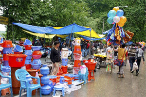 A vendor sells balloons on a road in Srinagar on Sunday. 