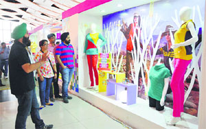 Visitors looks at the latest clothings at the Knitwear Hosiery Buyer-Seller Meet in Ludhiana.