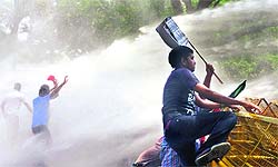 The police uses water cannons against BJY M activists during a protest near the PM's residence in New Delhi on Sunday