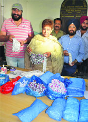 Excise and Taxation Department officials show unaccounted silver in Amritsar on Monday.