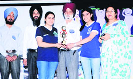 The administration of Sri Guru Harkrishan Senior Secondary Public School, Sultanwind Link Road, felicitates a student to mark the National Technology Day in Amritsar on Monday. 