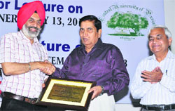Vice-chancellor of Central University of Punjab Dr Jai Rup Singh (left) presents a memento to Prof SK Salwan who delivered a lecture at the university on Monday. A Tribune photograph