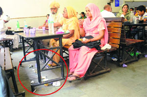 Litter lies strewn on the floor of a canteen in the New OPD Block of the PGI, Chandigarh. 