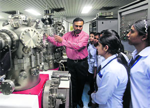 Students interact with scientists during an open day organised to commemorate Technology Day at the CSIO in Chandigarh on Monday. 