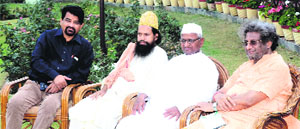 Anna Hazare along with Shantikunj head Pranav Pandya during his Jantantra Yatra in Haridwar on Monday. 