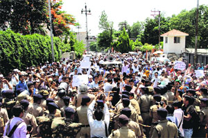 BTC teachers stage a demonstration outside the Secretariat in Dehradun on Monday. 