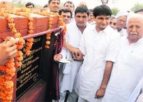 Rohtak MP Deepender Singh Hooda lays the foundation stone of a community centre at Gumana village in the Baroda Assembly segment recently
