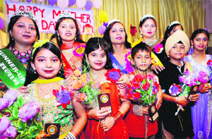Students of St Soldier, Group of Institutions along with their mothers at the Mothers Day programme Maa Tujhay Sallam in Jalandhar on Monday. 