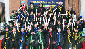 Tiny tots of the Giggles Wing of Guru Amar Das Public School in jubilant mood after the convocation held in Jalandhar. 