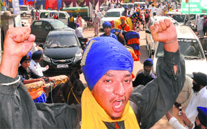 Devotees take part in a procession to mark the 303rd anniversary of Sirhind Fateh March at Fatehgarh Sahib on Monday.