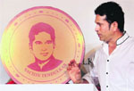 Sachin Tendulkar during the launch of a limited edition gold coin with his image embossed on it. 