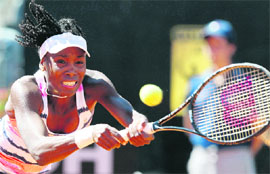 Venus Williams hits a return to Laura Robson during their singles match at the Rome Masters on Monday. 