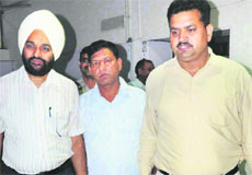 ASI Jagdish Ram (centre) being taken for a medical examination after being caught taking a bribe in Chandigarh on Tuesday.