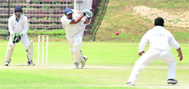 A batsman plays a shot during the Col AS Judge Memorial T-20 Knockout Cricket Tournament at the Cricket Stadium, Sector 16, in Chandigarh on Tuesday. 