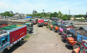 Trucks parked haphazardly on a roadside in Transport Nagar in the Narwal area of Jammu. 