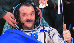 Canadian astronaut Chris Hadfield gestures after the Russian Soyuz space capsule landed some 150 km southeast of the town of Zhezkazgan, in central Kazakhstan on Tuesday. 