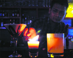 A mixologist serves a drink at Cafe OZ in Amritsar on Wednesday. Tribune photo: Sameer Sehgal 